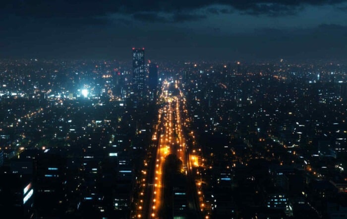 A_city_skyline_at_night_with_street_lights_equipped_with_smart_control